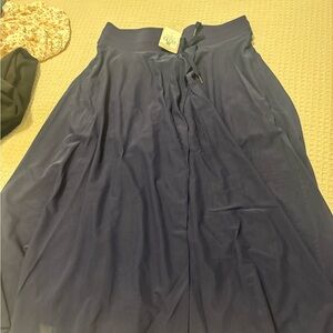 Set of 2 Halara long skirts with shorts underneath.